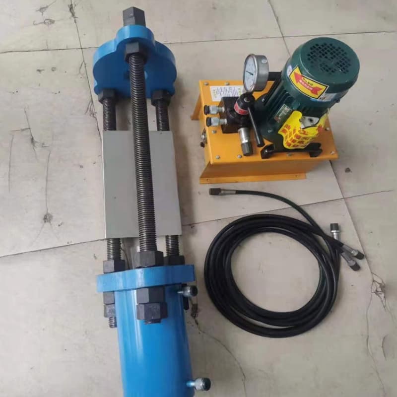 Hydraulic track pin pusher